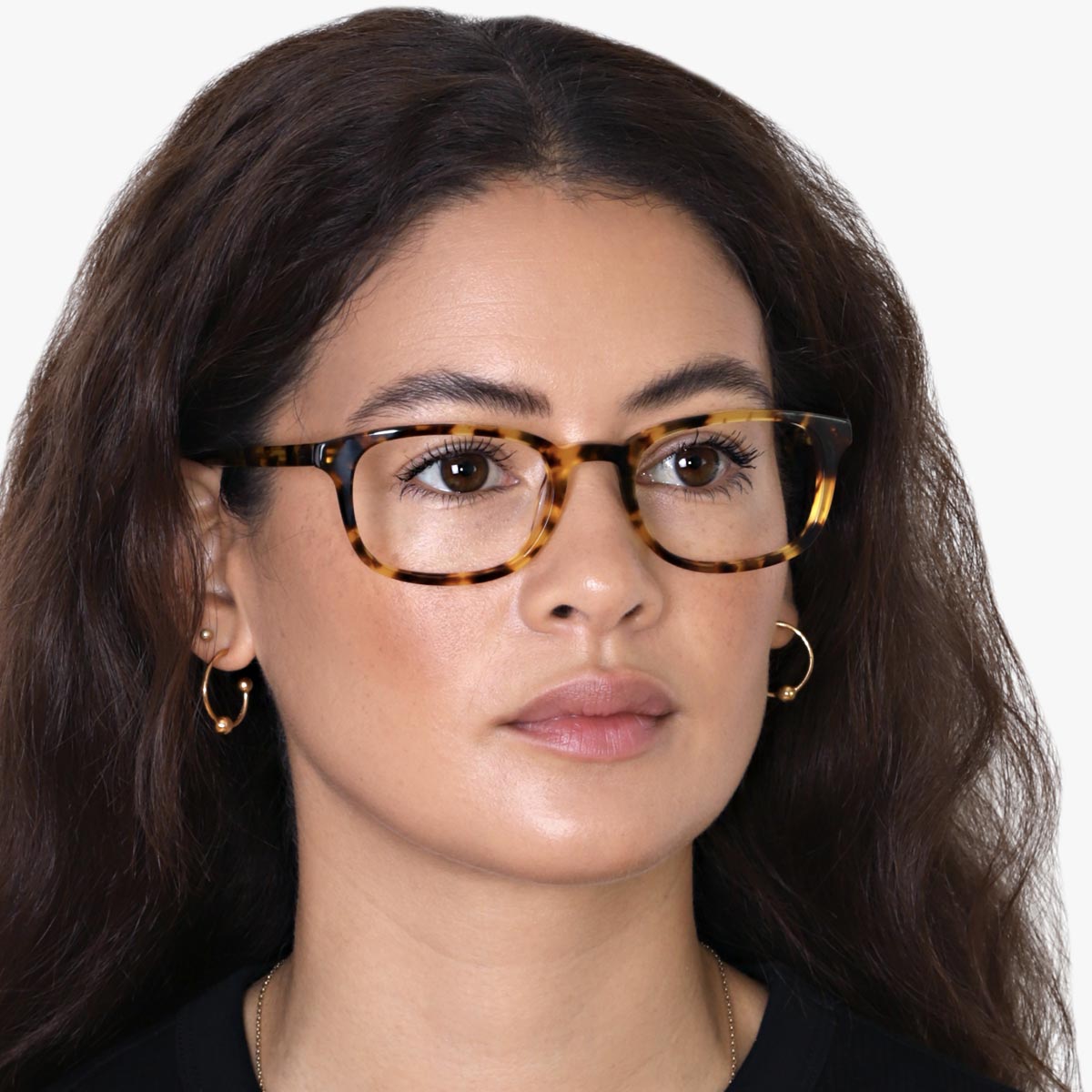 Person wearing Devon Light Turtle glasses with tortoiseshell frames