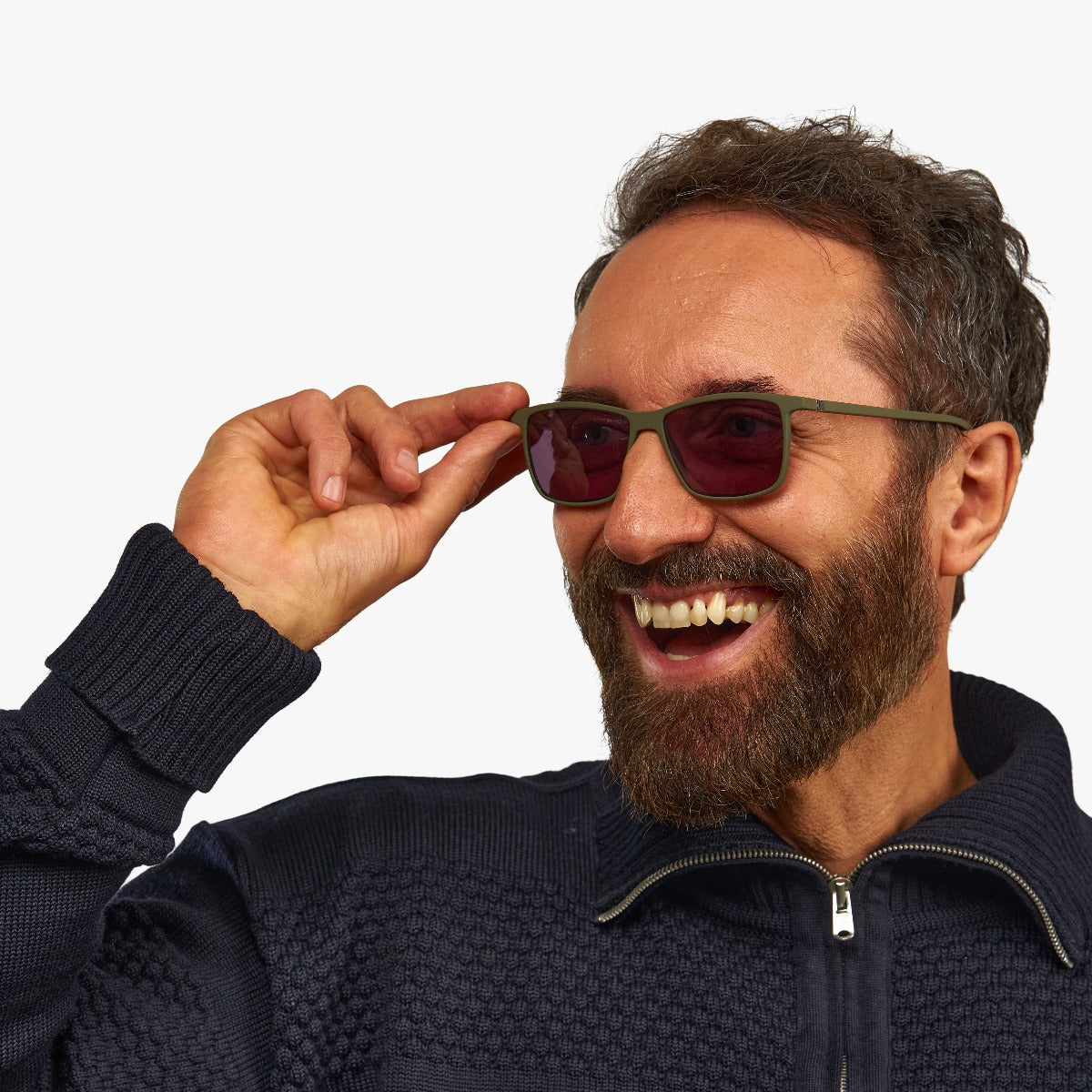 Person wearing København Dark Army sunglasses with green frame