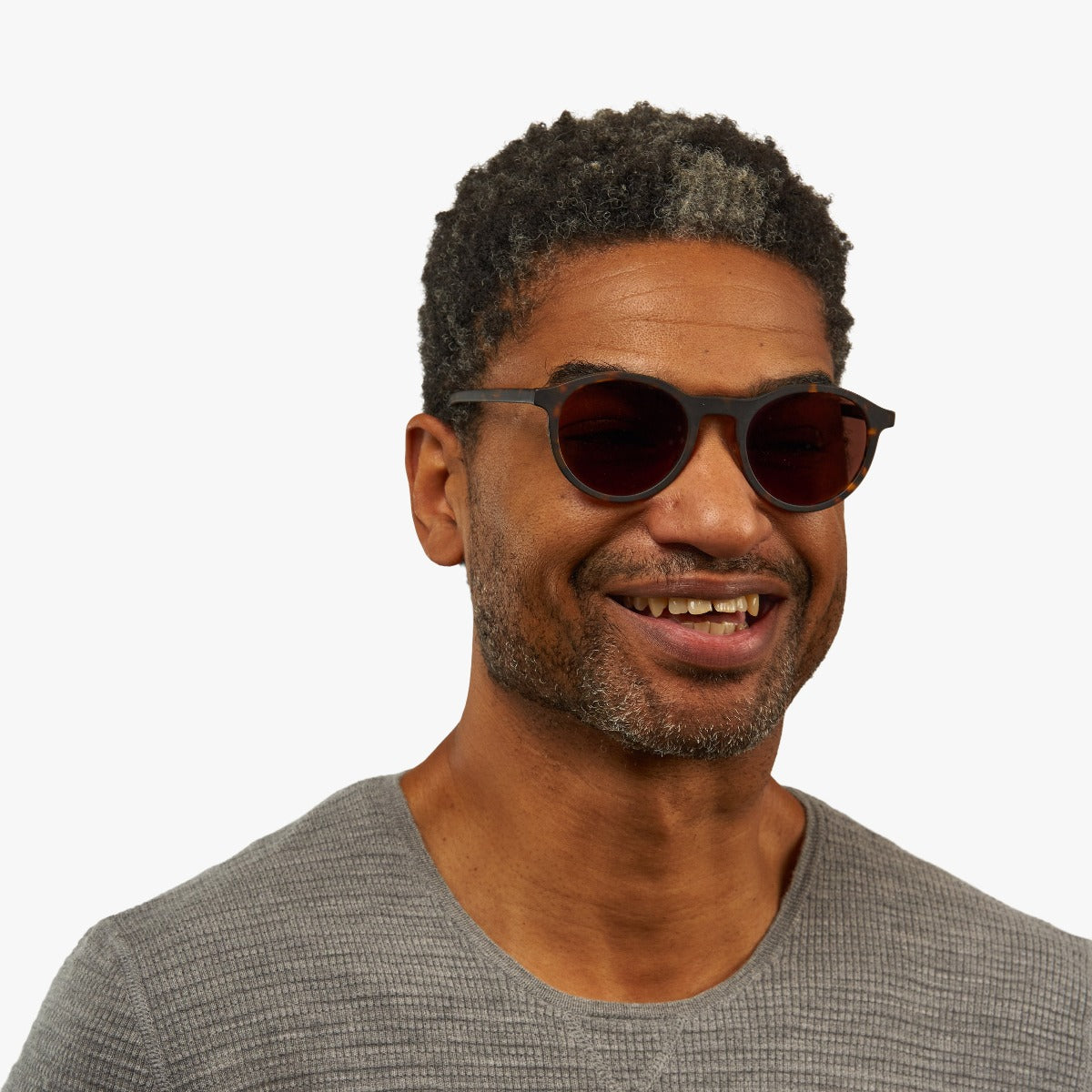 Person wearing Løkken Dark Turtle sunglasses