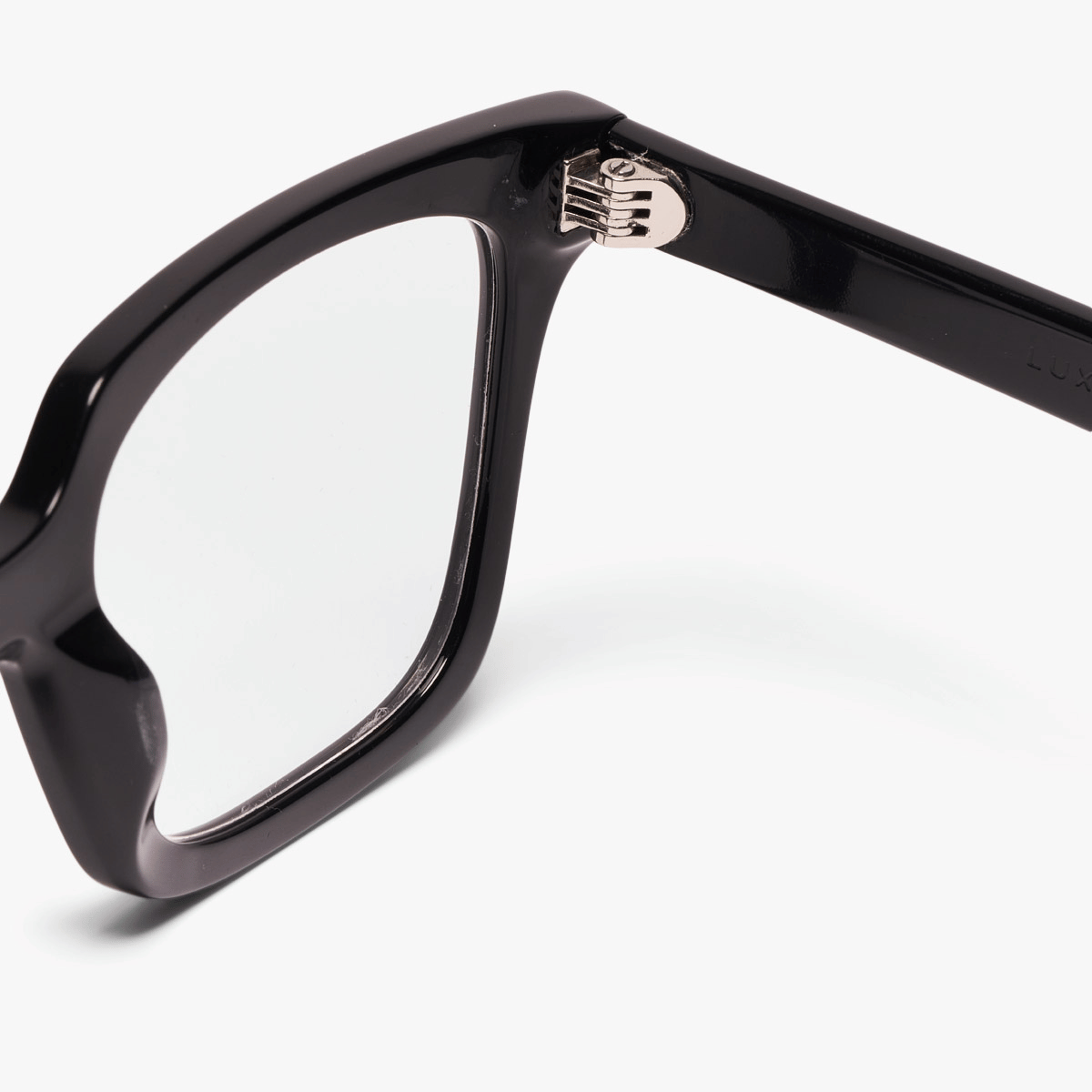 Close-up of Tisvilde black glasses with Luxreaders logo on hinge