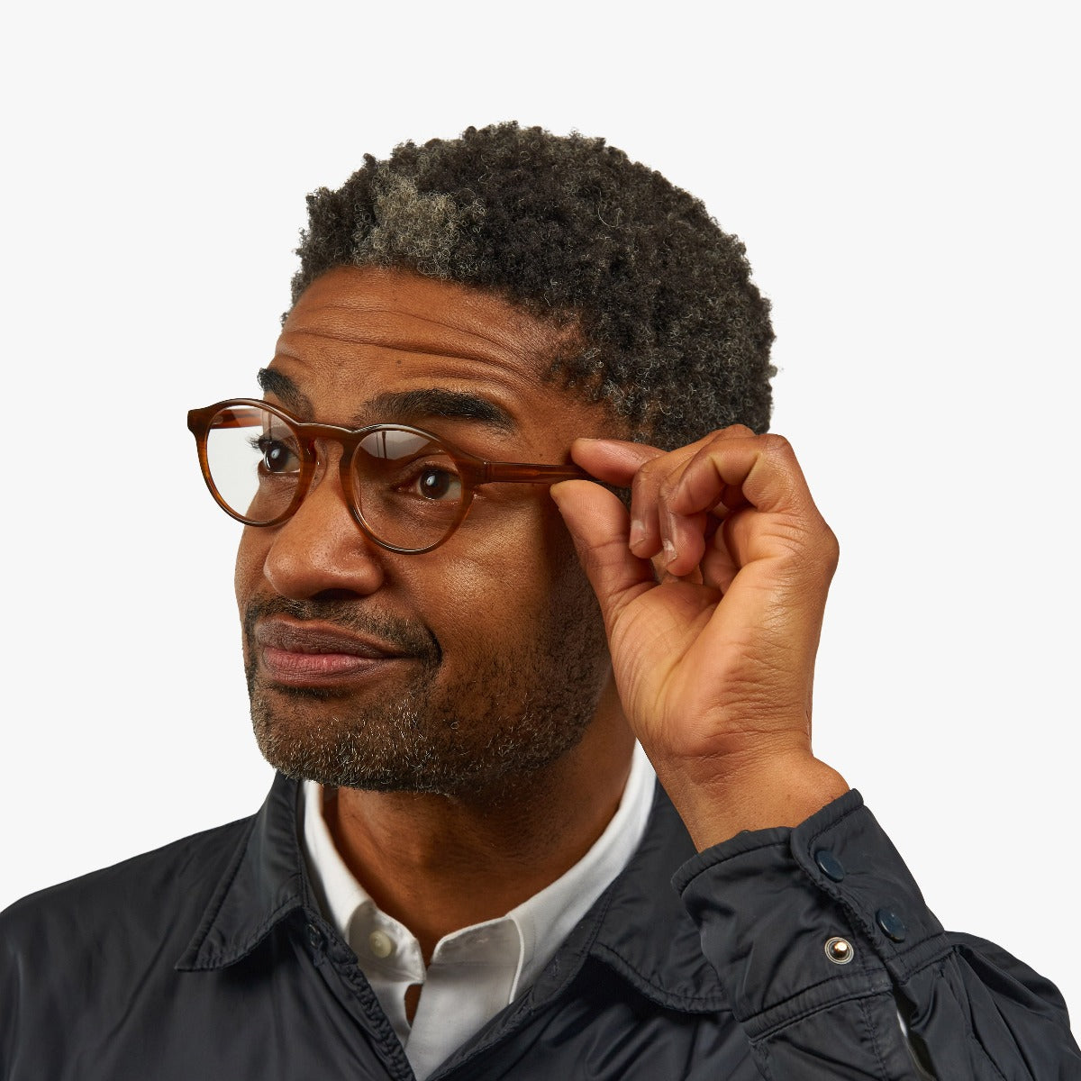 Person wearing shiny walnut reading glasses