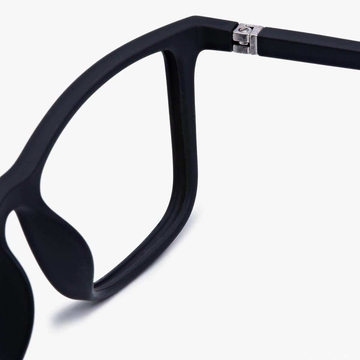 Close-up of black square glasses frame hinge