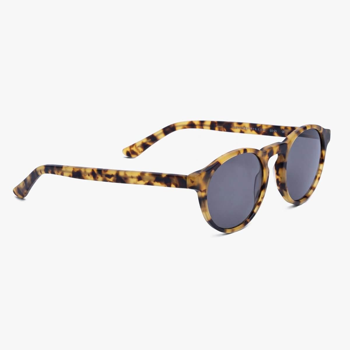 Tortoiseshell round sunglasses with dark lenses