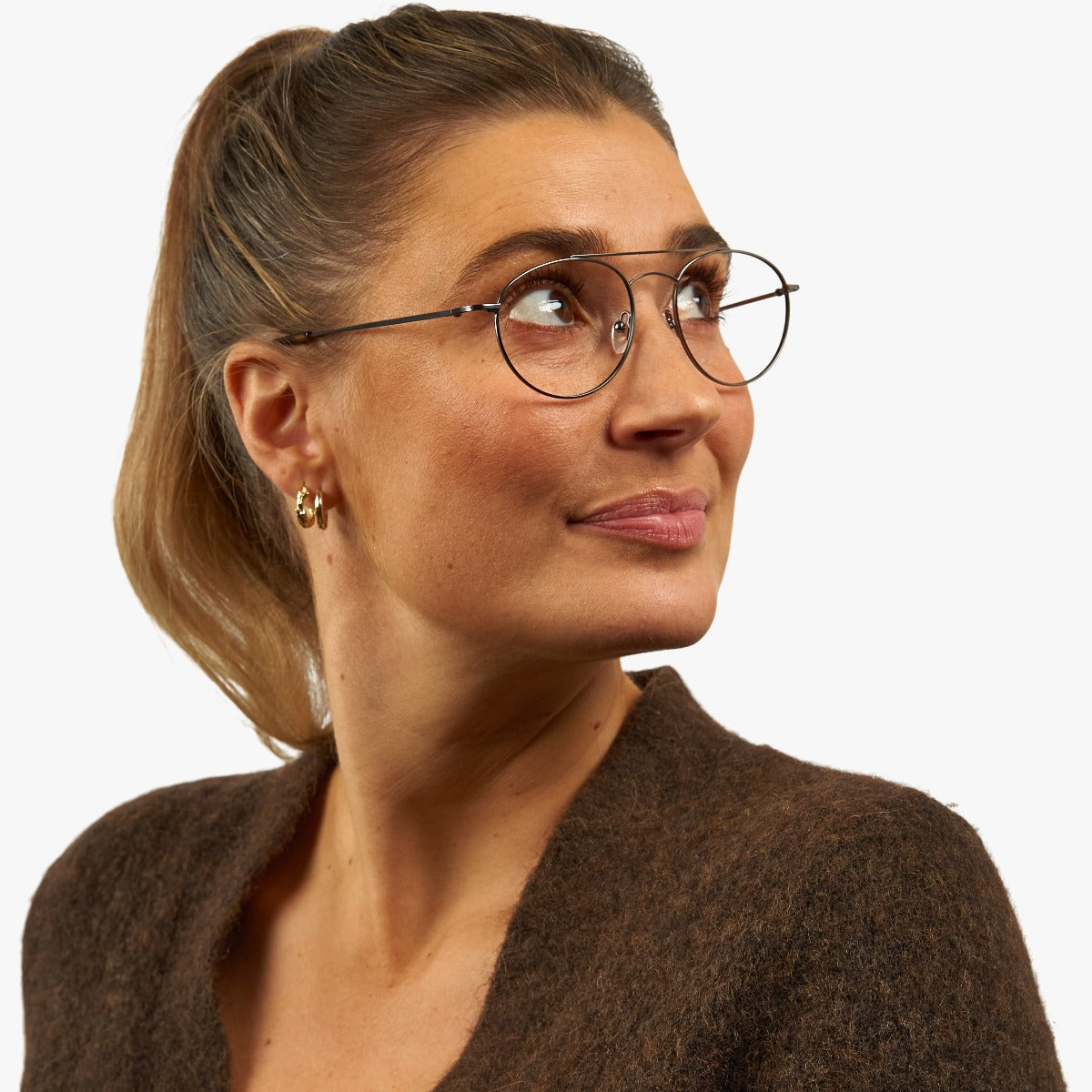 Person wearing Women's Göteborg Gun reading glasses