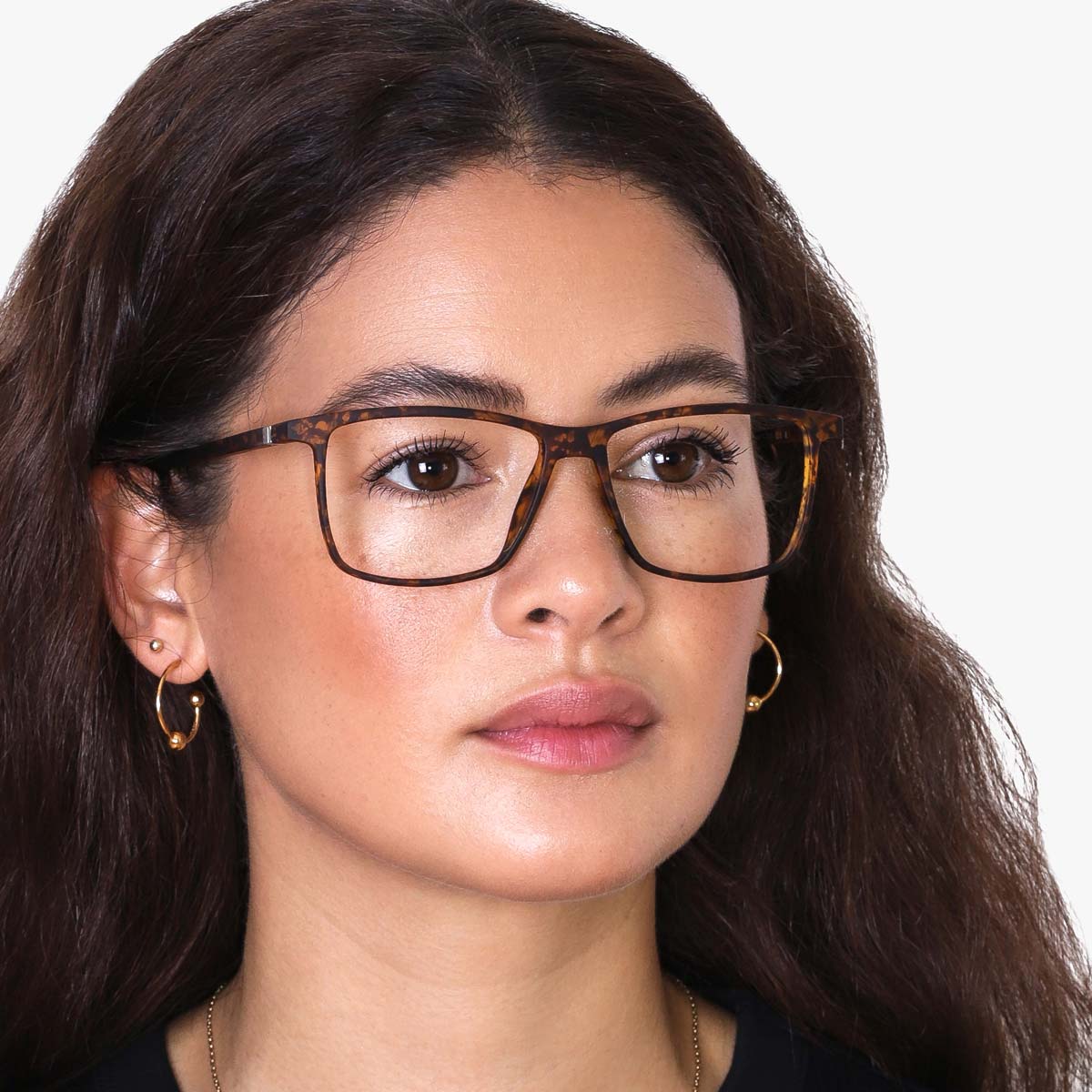 Person wearing tortoiseshell rectangular glasses