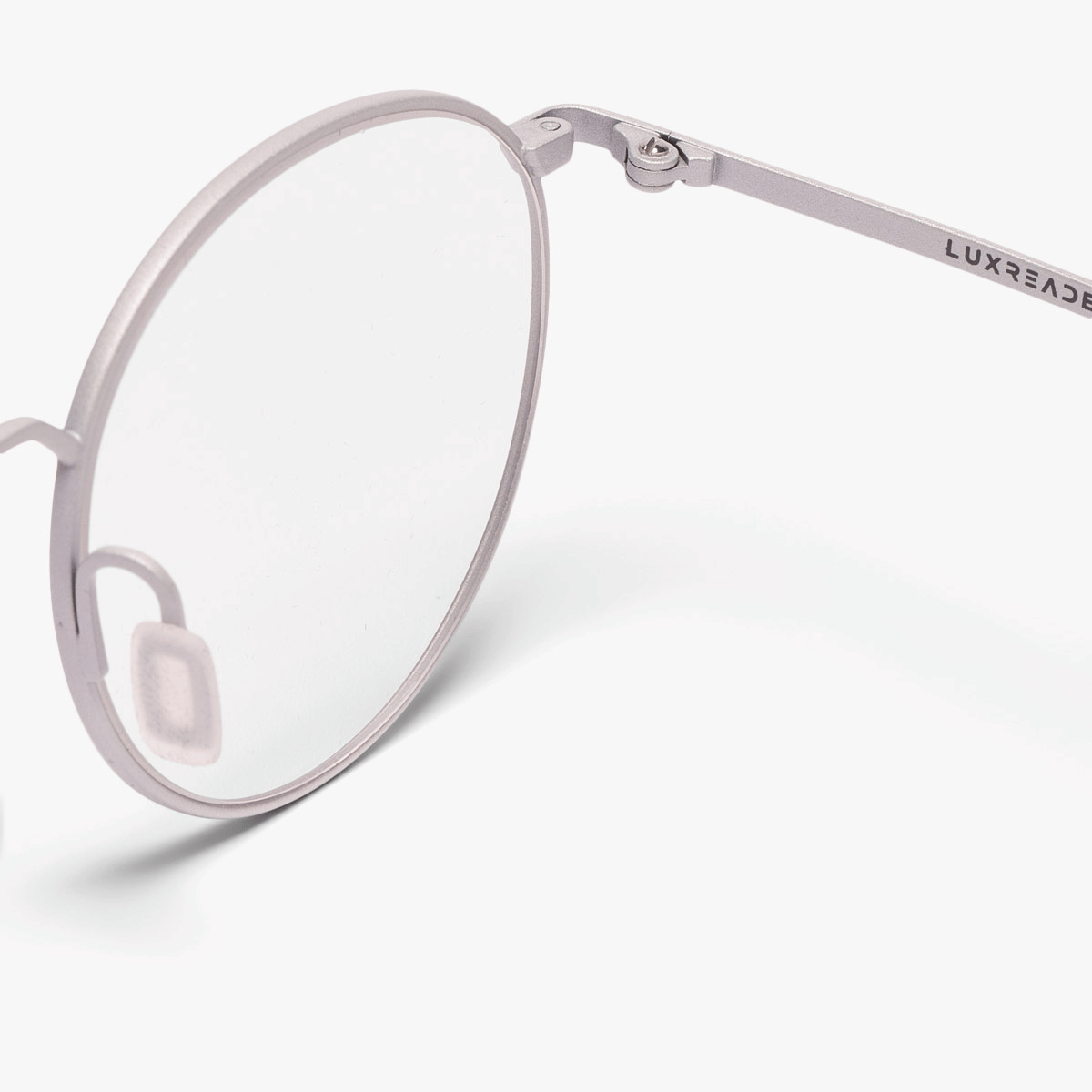Round silver reading glasses with Luxreaders logo on the temple