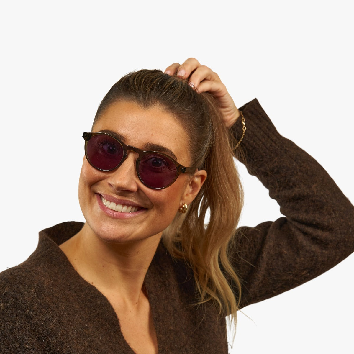 womens-trondheim-shiny-olive_sunglasses_female-model-1.jpg?v=1771417762&width=1200